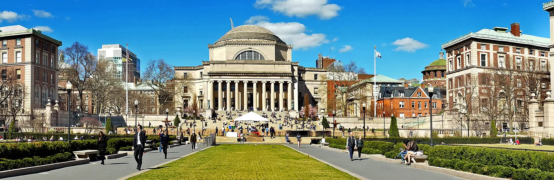 Blue sky with neo-classical buildings and lots of steps leading up to them